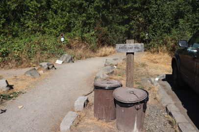 Signage on Ranch Dike Trail – trash cans – along parking lot